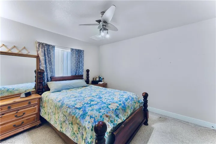 Bedroom featuring carpet and ceiling fan