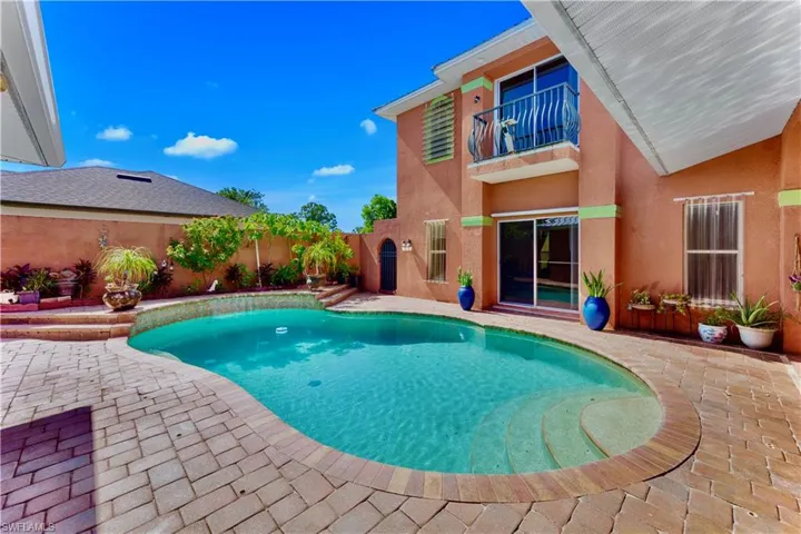 View of swimming pool featuring a patio area and a fenced backyard