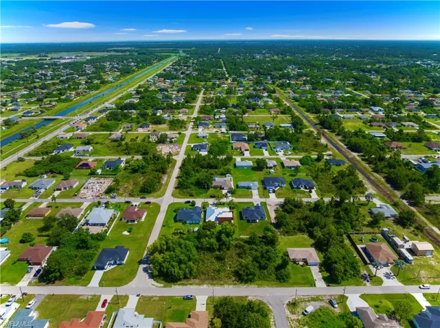 View of property location with nearby suburban area