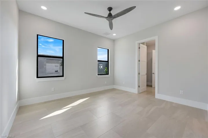 Spare room with ceiling fan