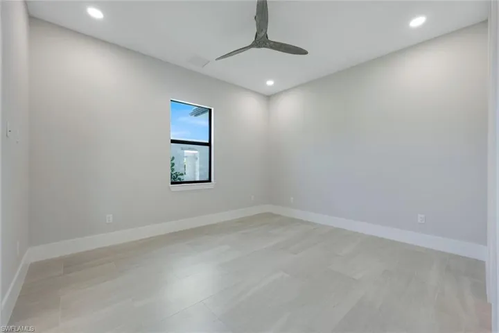 Empty room featuring ceiling fan