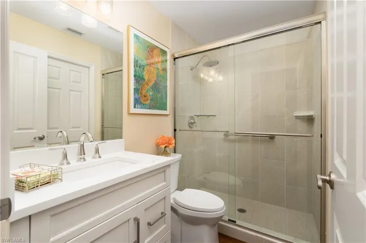 3rd Bathroom featuring Quartz vanity and glass shower