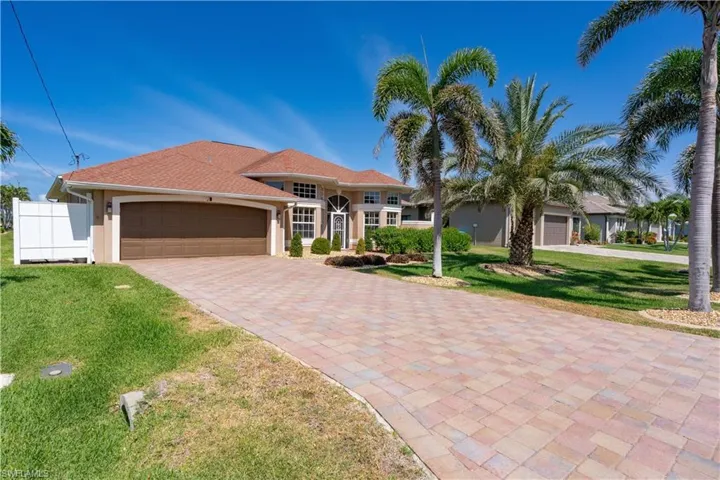 Mediterranean / spanish-style home featuring decorative driveway
