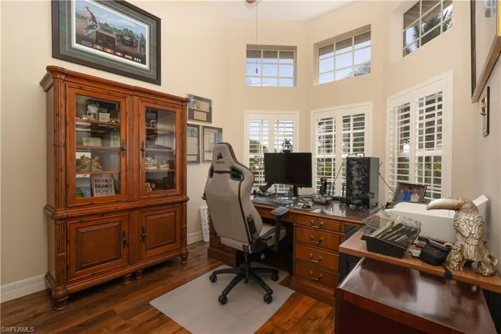 Office featuring bay window and plantation shutters