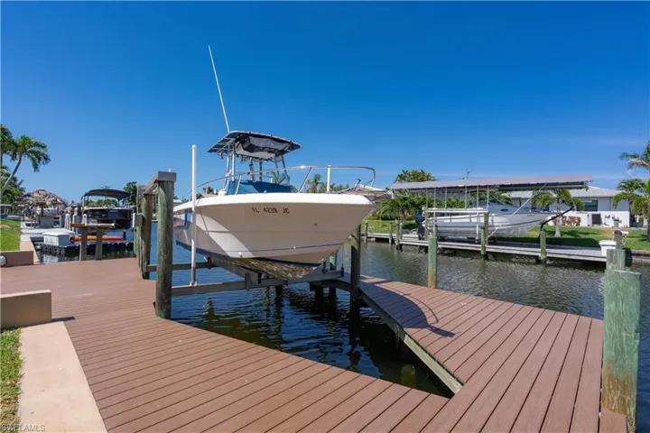 Dock with a water view and boat lift