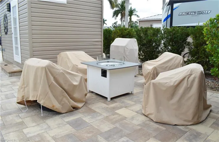 View of patio featuring a fire pit