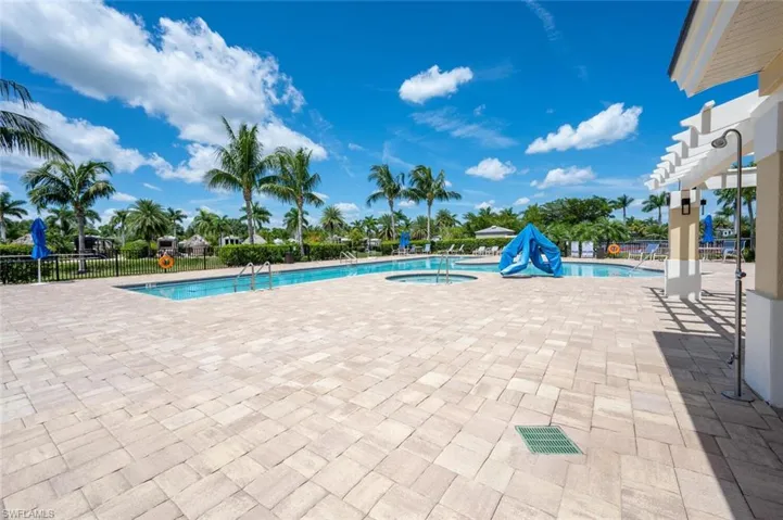 Community pool with a patio and a community hot tub