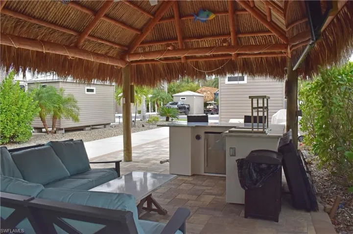 View of patio with a gazebo, outdoor lounge area, and area for grilling