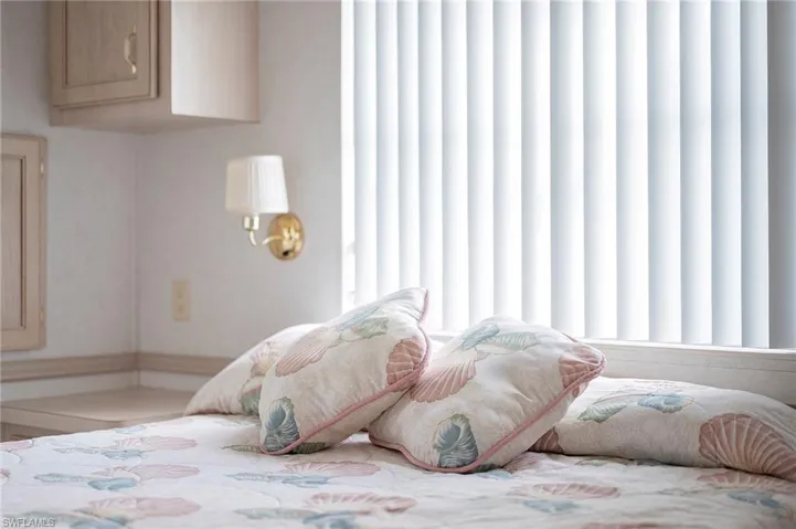Bedroom featuring multiple windows