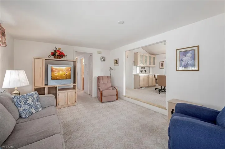 Living room with light colored carpet