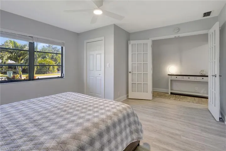 Bedroom featuring light wood-type flooring and ceiling fan