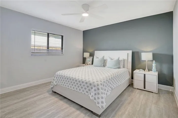 Bedroom featuring light wood-type flooring and ceiling fan