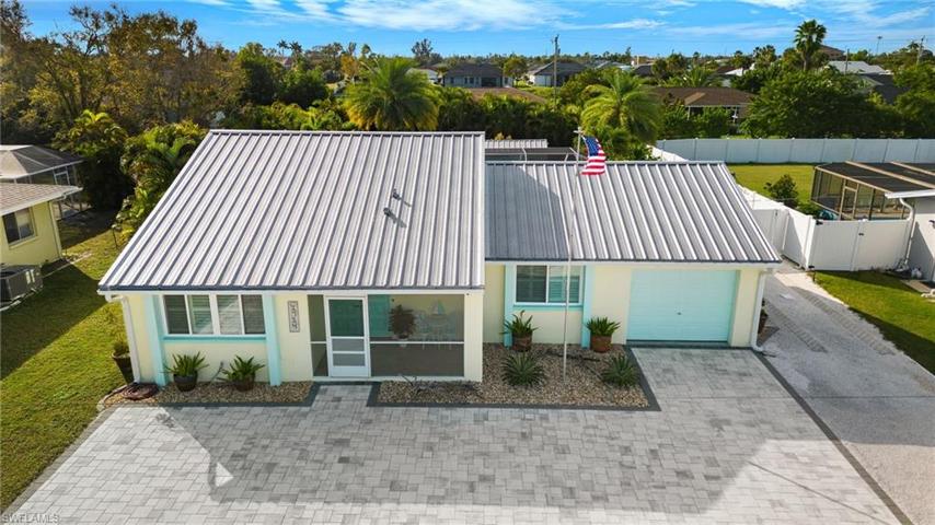 Front view of home. Tastefully landscaped and lots of room for parking.