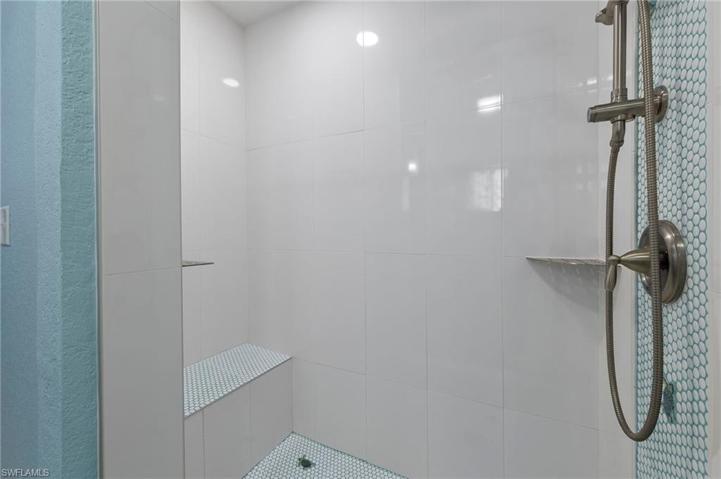Spacious and beautifully tiled primary bath shower.