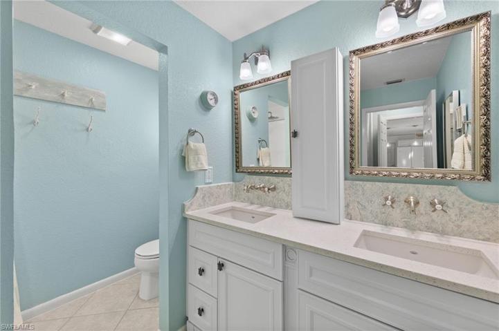 Primary bath with dual sinks, beautiful fixtures and separate water closet.