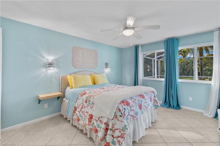 Primary bedroom.  Floor tiles on the diagonal.