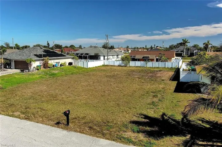 View of yard featuring an attached garage