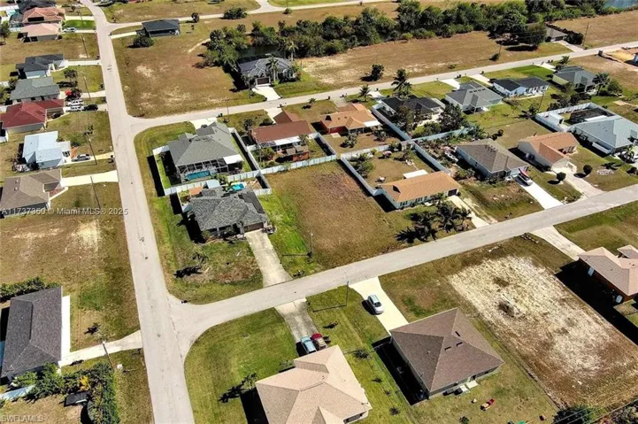 Aerial view of property's location with nearby suburban area