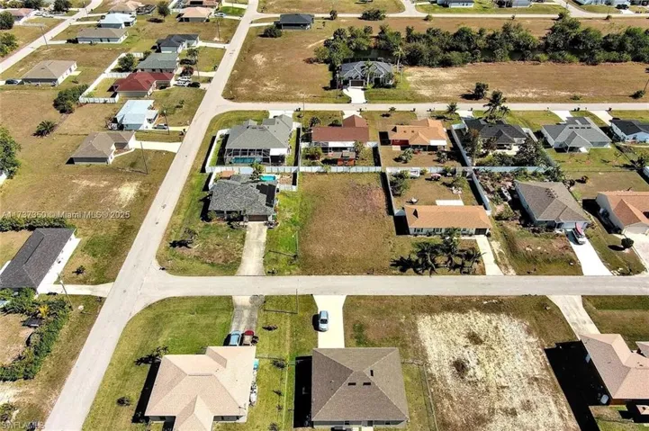 Aerial overview of property's location with nearby suburban area