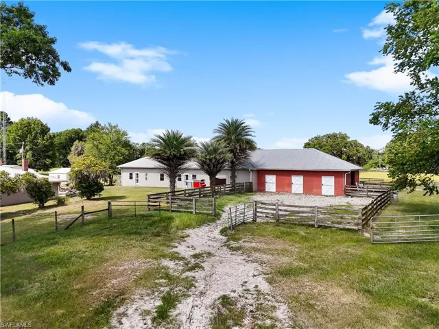 View of yard with a rural view