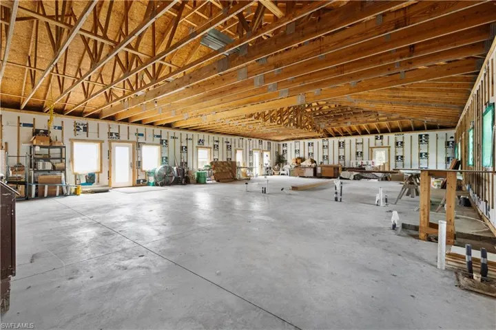 Misc room with concrete floors and lofted ceiling