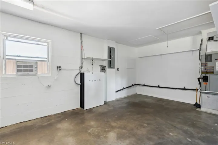 View of garage and Tesla solar batteries