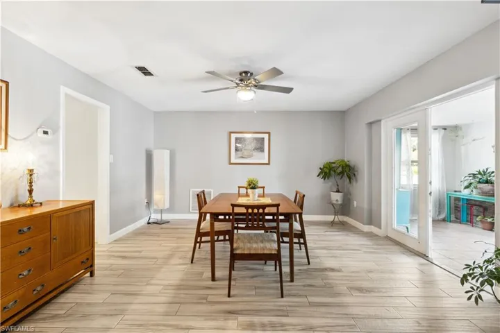 Dining area with ceiling fan and tile