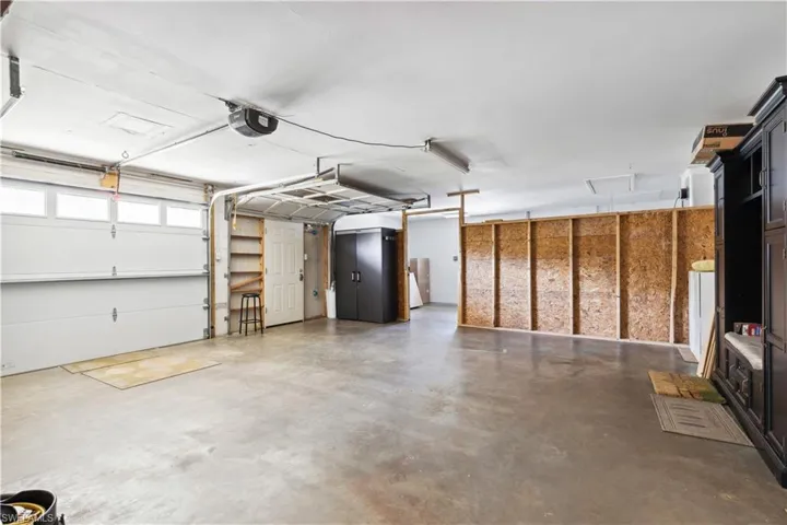 Garage featuring a garage door opener
