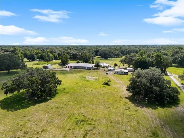 Birds eye view of property featuring a rural view
