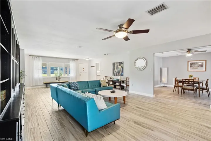 Living room with tile and ceiling fan