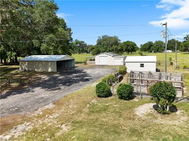 Tractor barns, carport, and raised garden beds