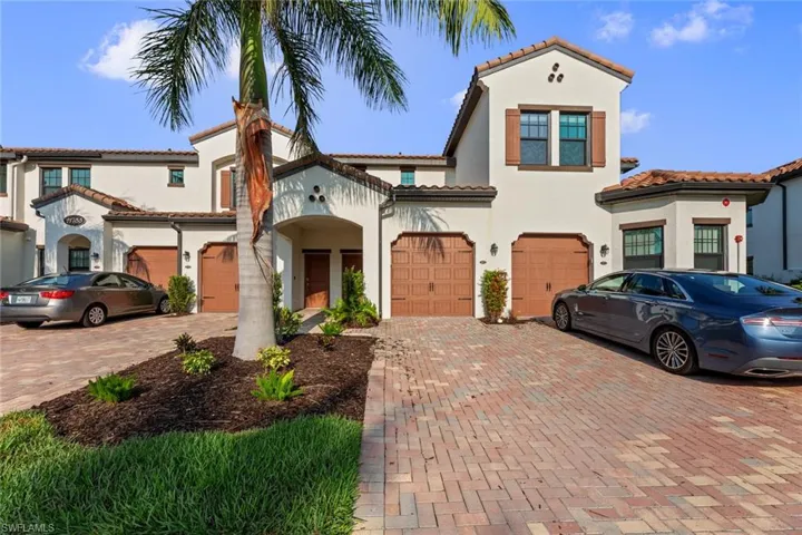 Mediterranean / spanish-style home with a garage