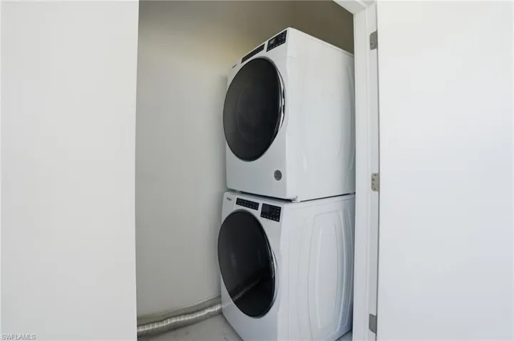 Washroom with stacked washer / drying machine - Virtually Edited Image