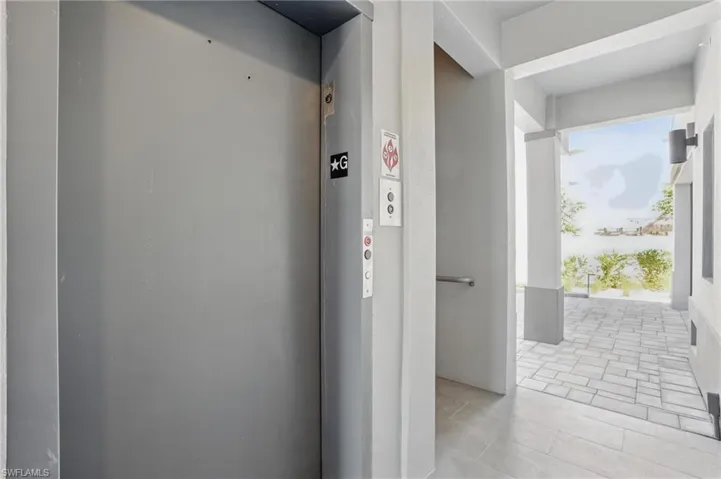 Ground Level Entry Hall featuring Elevator + Stairwell - VIRTUALLY EDITED