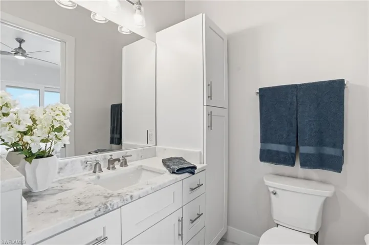 Bathroom featuring vanity and toilet - Virtually Edited Image