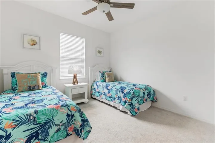 Bedroom featuring carpet floors and ceiling fan