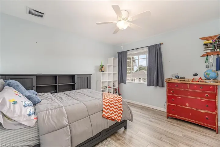 Bedroom featuring light hardwood / wood-style floors and ceiling fan