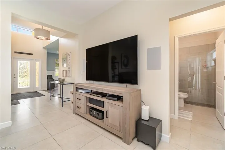 Living room featuring light tile patterned floors