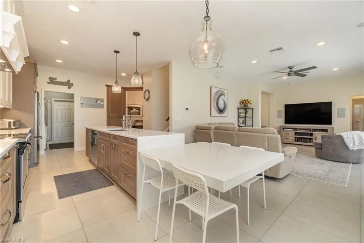 Island with attached table, quartz counters
