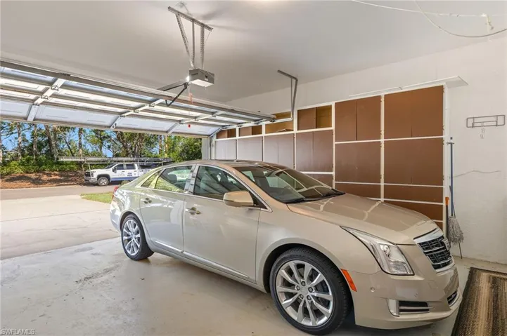 Garage featuring a garage door opener