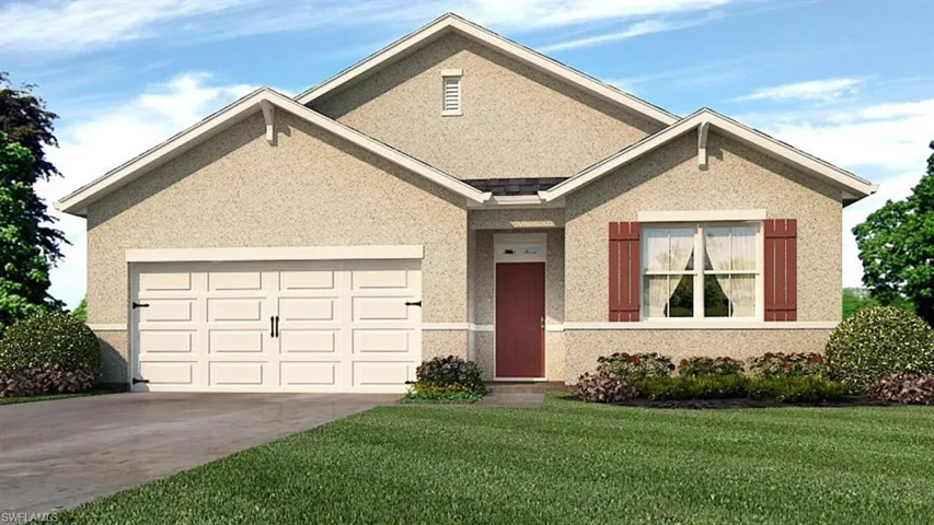 View of front of property with a garage and a front yard