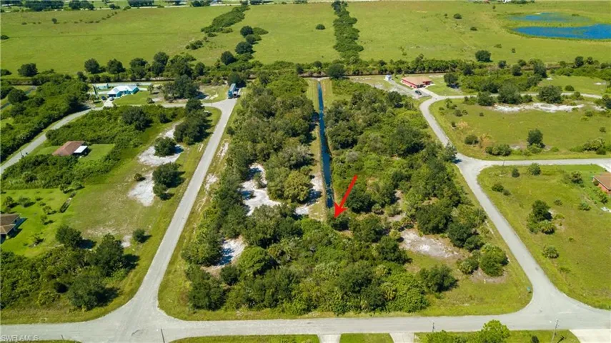 Aerial view of property and surrounding area featuring rural landscape