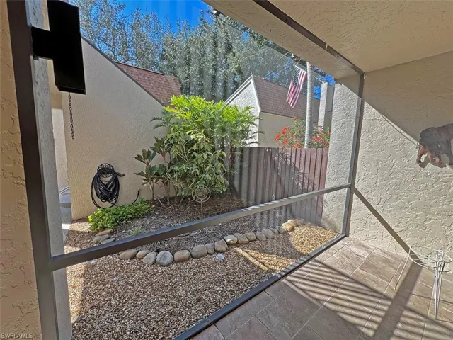 Front courtyard has screened porch, plus open landscape area