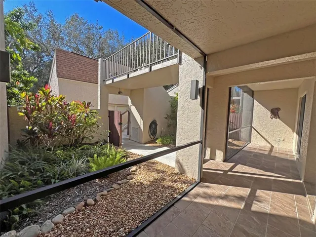 Front courtyard has screened porch, plus open landscape area