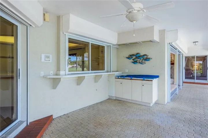 Summer Kitchen with pass through window from inside kitchen