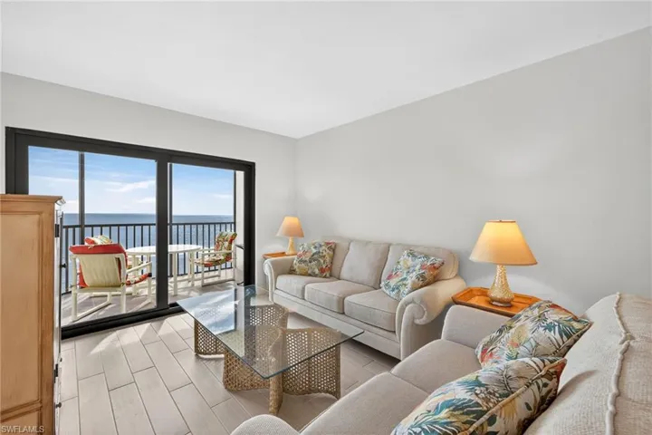 Living area featuring a water view and light wood finished floors