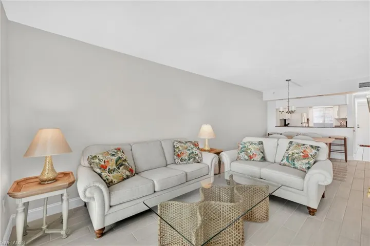 Living room featuring a chandelier and wood finish floors