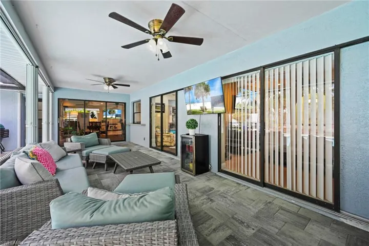 Shaded Patio with outdoor lounge area and a ceiling fan