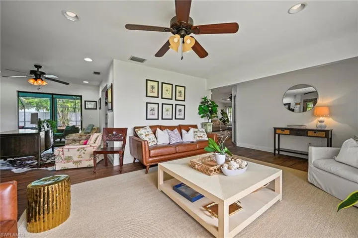 Living area featuring recessed lighting, ceiling fan, and wood finished floors