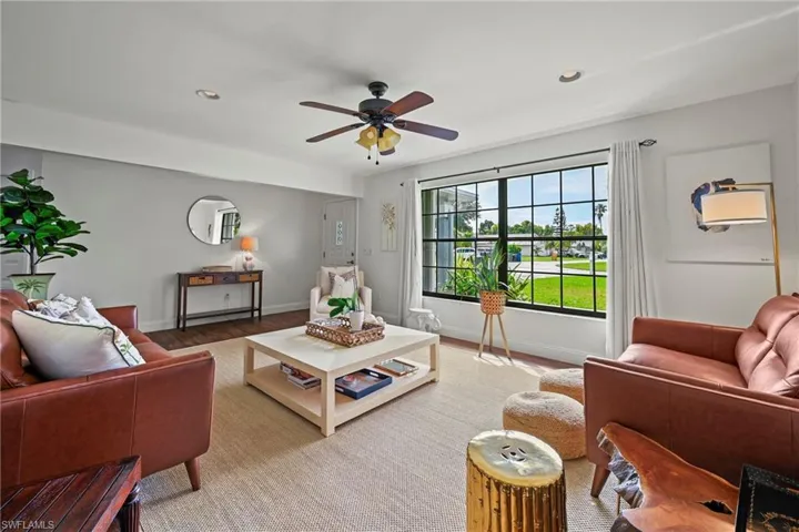 Living area featuring recessed lighting, a ceiling fan, and wood finished floors